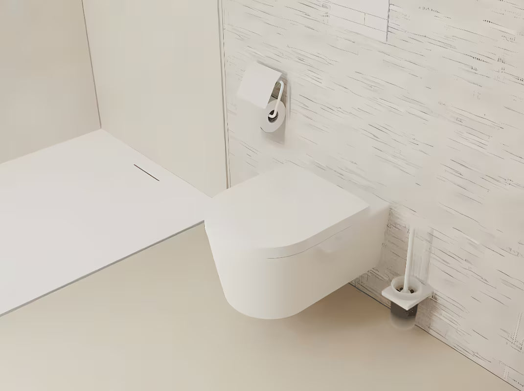 Stenska WC ščetka hansgrohe addstoris v mat beli barvi z držalom iz kovine in s stekleno posodo.