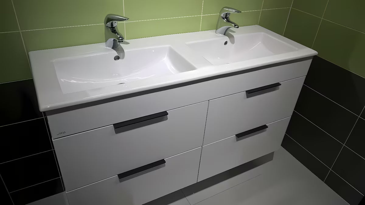 Bílá závěsná koupelnová skříňka Jika Plan s keramickým dvojumyvadlem a zásuvkami s plnovýsuvem.