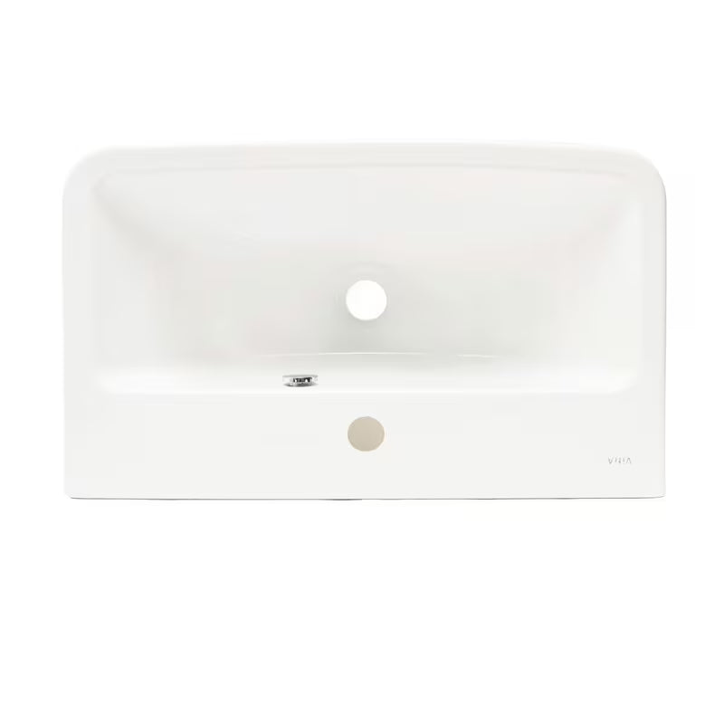 Bílé závěsné umyvadlo Vitra Integra 60x36 cm z keramiky s otvorem pro baterii uprostřed a přepadem.