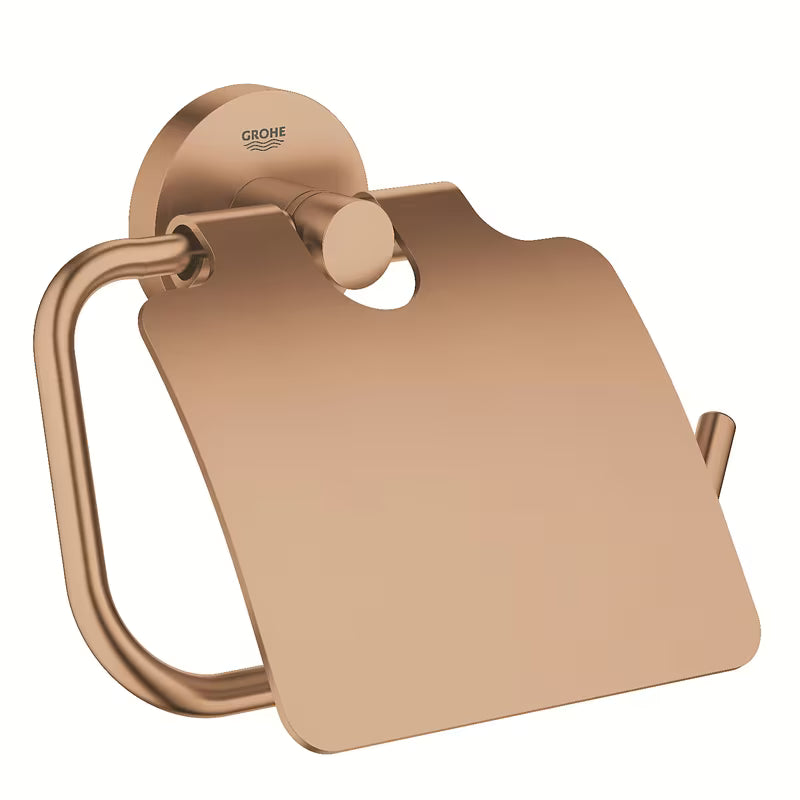 Držák toaletního papíru Grohe Essentials s krytem v provedení Brushed Warm Sunset se skrytým upevněním.