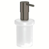 Dávkovač mýdla Grohe Essentials bez držáku se skleněnou nádobkou a povrchem Grohe StarLight v provedení hard graphite.