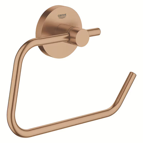 Držák toaletního papíru Grohe Essentials bez krytu v povrchové úpravě Brushed Warm Sunset se skrytým upevněním.