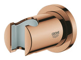 Nástěnný držák ruční sprchy Grohe Rainshower s kulatou rozetkou v povrchové úpravě Warm Sunset.