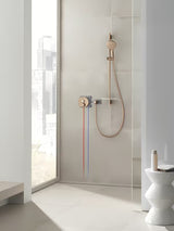 Ruční sprcha Grohe Rainshower SmartActive 130 v povrchu brushed warm sunset s tlačítkem SmartTip