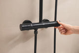 Matně černý sprchový systém Grohe Tempesta System Cube s termostatickou baterií, hlavovou a ruční sprchou