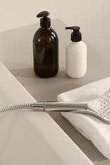 Kromirana tuš ročka Hansa Viva, ročna prha s 3 funkcijami, premer 11 cm.