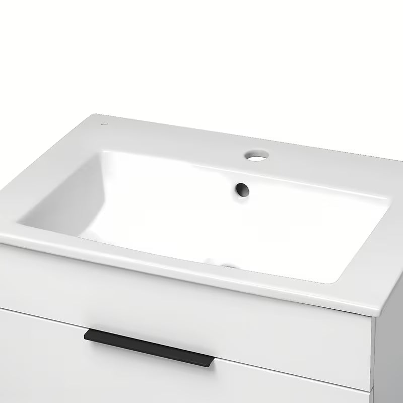 Bílá závěsná skříňka Jika Plan s keramickým umyvadlem a zásuvkami s plnovýsuvem.