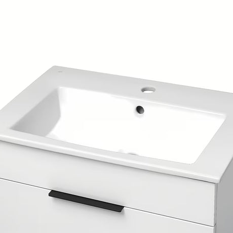 Bílá závěsná skříňka Jika Plan s keramickým umyvadlem a zásuvkami s plnovýsuvem.