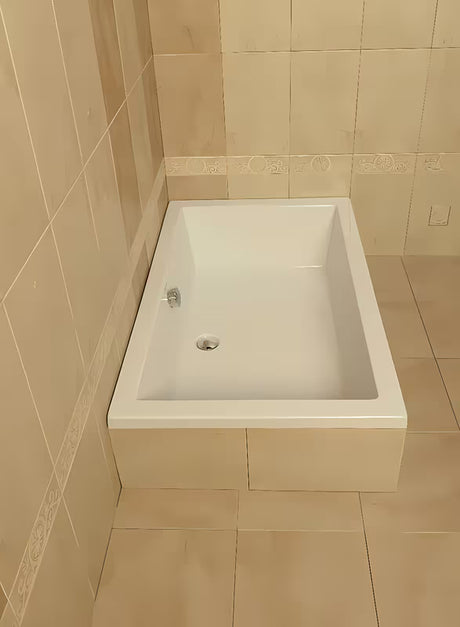 Bílá obdélníková sprchová vanička Polysan Deep z akrylátu Akripol 120x75 cm s přepadovým otvorem.