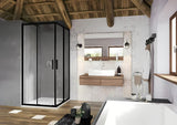 Čtvercový rohový sprchový kout Ravak Blix Slim 90x90 cm v černé barvě s čirým sklem a posuvnými dveřmi.