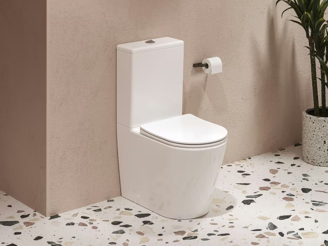 Bílé volně stojící WC kombi Ravak Elegant RimOff se sedátkem SoftClose a duálním splachováním 3/6 l.