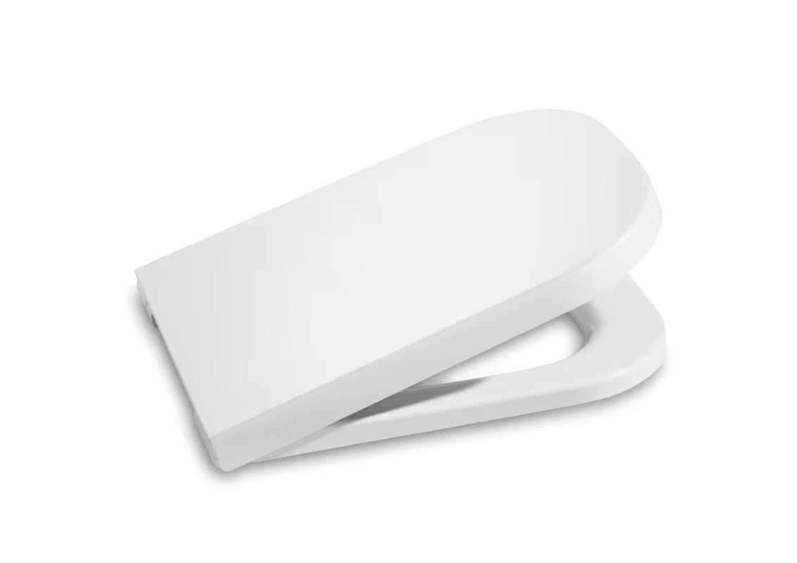 Bílé WC sedátko Roca The Gap s funkcí SoftClose a nerezovými panty