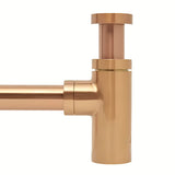 Mosazný umyvadlový sifon SAT Aurum v barvě rose gold s kulatým designem a průměrem 32 mm.