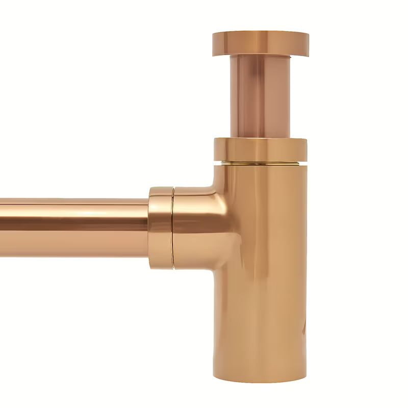 Mosazný umyvadlový sifon SAT Aurum v barvě rose gold s kulatým designem a průměrem 32 mm.