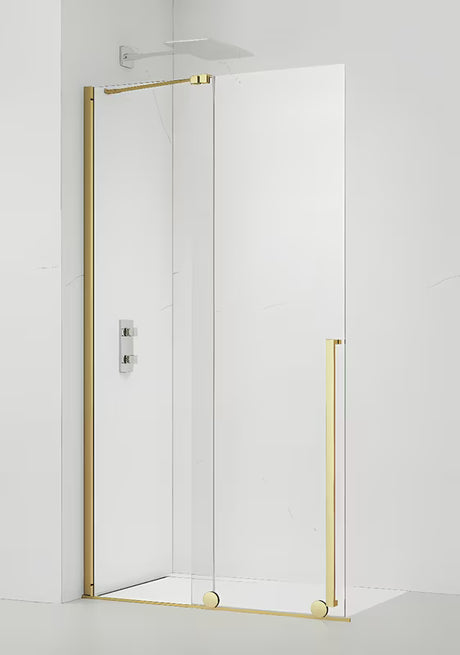 Walk-in sprchová zástěna SAT Xmotion 110 cm ve zlatém lesku s čirým sklem a bezrámovým provedením.