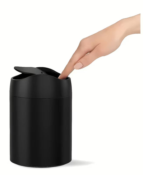 Černý stolní odpadkový koš Simplehuman Mini s vyklápěcím víkem a objemem 1,5 l.