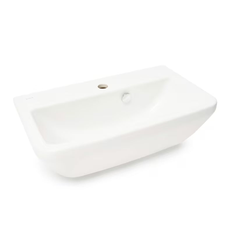 Bílé závěsné umyvadlo Vitra Integra 60x36 cm z keramiky s otvorem pro baterii uprostřed a přepadem.